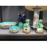 A pair of Chinese models of parrots, a pair of dogs of Fo, a Chinese vase converted to a lamp, and