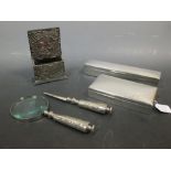 Two silver table cigarette boxes, silver mounted desk letter holder and an EPNS letter opener and