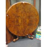 A mid Victorian figured walnut pedestal breakfast table, 127cm diameter