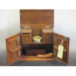 An oak smokers cabinet and a drawing set