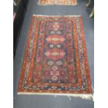 A twentieth century tribal rug, 170 x 120cm