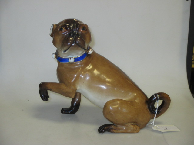 A German porcelain model of a seated pug