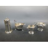 An Edwardian silver sauceboat, 6ozt, a silver two piece tea service of faceted form comprising cream