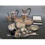 A quantity of silver to include a Georg Jensen spoon, a pair of small toastracks, cruet, teaspoons