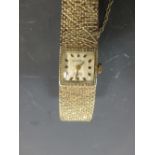 A Nostrana gold ladies wristwatch stamped 585 (31g total)