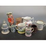 A collection of English pottery to include a puzzle jug frog mugs etc