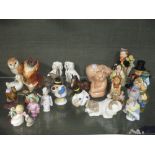 A quantity of Beswick, Doulton, Wade, Goebel, Poole, Coalport and other decorative figures