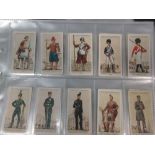 A large quantity of cigarette cards, many in plastic sleeves
