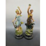 A pair of painted spelter figures 'Travail' and 'Agriculture'