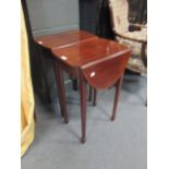 A pair of reproduction mahogany oval top side tables, 64 x 43.5 x 30cm