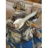 A painted terracotta sculpture of a lute player, 60 x 40 x 30 cm