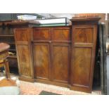 A 19th century mahogany press with hanging cupboards, fitted compartment with pigeon holes, 242cm