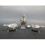 A pair of silver sauce boats by Walker & Hall, Sheffiled 1922 and a silver sugar caster (marks
