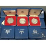 Eighteen 1977 silver crowns, each boxed