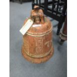 A Chinese iron bell, Qing dynasty, surface very pitted, later painted