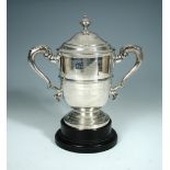 An Edwardian silver two handled pedestal trophy cup and cover, William Hutton & Son, London 1907,