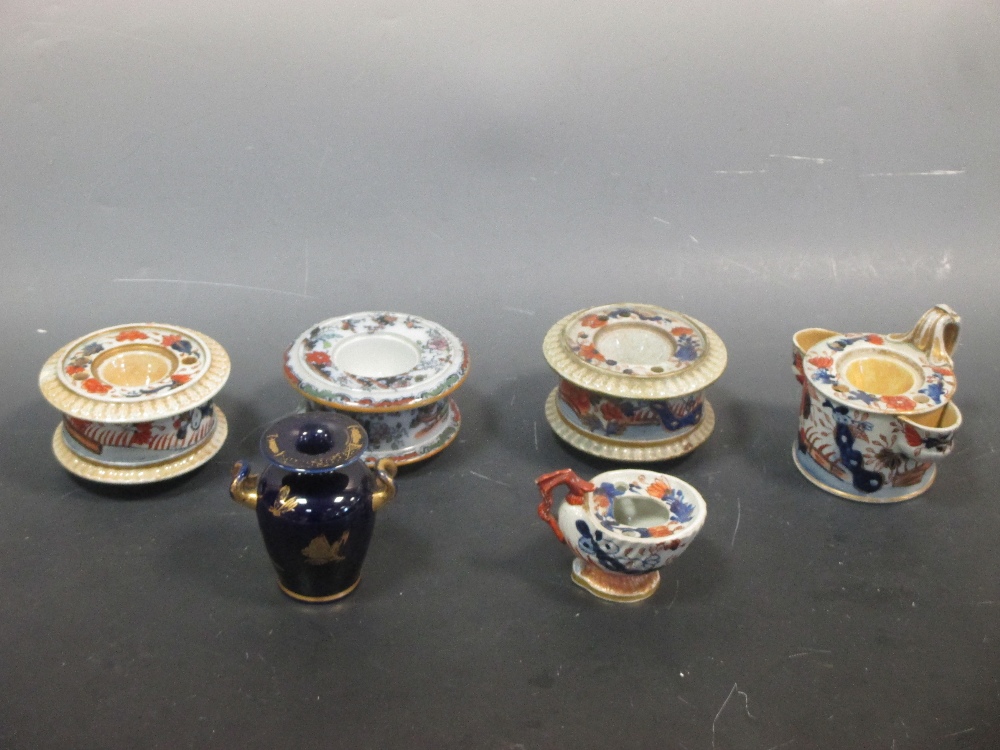 Five ironstone inkwells and a Mason's type two handled vase