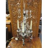 A gilt metal and glass lustre four branch table light