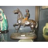 A 19th bronzed spelter figure of a horse and jockey