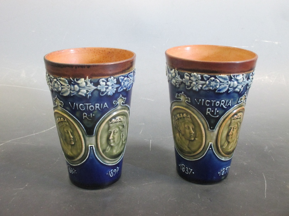 Two Royal Doulton Queen Victoria stoneware diamond jubilee beakers