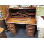 An early 20th century oak tambour fronted clerk's desk, 125 x 128 x 82cm