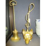 A fox head brass door stop and another (2)