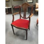 A set of ten reproduction mahogany dining chairs to include two carvers (10)