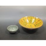 A Persian 'Tang Splashed' bowl, 29cm diameter together with a Chinese crackled celadon bowl, 12.