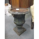 A Victorian style cast iron garden urn, 40cm diameter