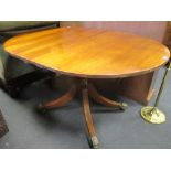 A 19th century small mahogany extending dining table