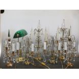 A pair of gilt metal and glass lustre table lights, another pair and two further small pair and a