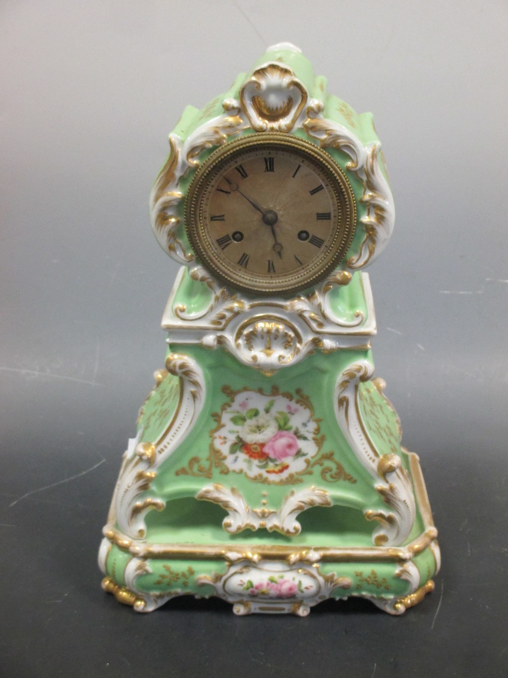 A Paris porcelain clock and stand