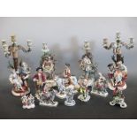 Collection of continental porcelain figurines to include Count Bruhl, a Dresden rabbit seller and