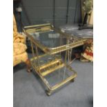 A brass and glass hostess trolley, 71 x 71 x 42cm