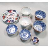 An early 18th century Imari plate, two covered bowls, a Fukugawa sake bowl and two Chinese famille