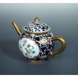 A late 18th/early 19th century tea pot and cover, painted with gold framed reserves of butterflies