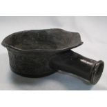 A 19th century bronze clothes iron, the rim peaking over the handle socket, the body cast with three