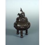 A late 19th/early 20th century bronze censer and cover, the latter with lioness and cub finial and