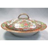 A late 19th century Canton covered bowl, typically painted with panels of birds, butterflies and