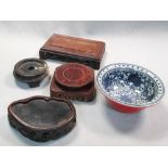 A 19th century Chinese Thai export bowl and four wood stands, the blue and white interior of the