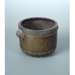 An 18th century bronze censor, the rim of the cylindrical sides cast with lotus band above horned