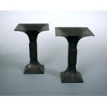 A pair of early 20th century bronze 'Gu' shaped vases, the square rims flaring above a rib central