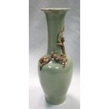 A late 19th/early 20th century celadon vase, the tall neck and broad shoulders of the baluster shape