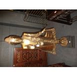 A modern Thai gilt wood standing Buddha, his right hand raised, his robes and headdress inset with