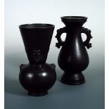 Two late 19th/early 20th century bronze vases, one of baluster shape with two stylised dragon