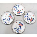 Four Kakiemon palette plates, each painted with a curling spray of red flowers within the petal