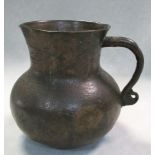 A Han dynasty bronze mug, the upper terminal of the handle attached to the flaring cylindrical