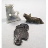 A grey stone pelican pendant, soapstone crane group and a greenstone Buddhist lion, the S-shaped