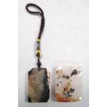 A rectangular shadow agate pendant together with a jade pendant, the first carved in relief on one