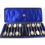 A set of 12 Victorian silver teaspoons and sugar tongs, London 1896/98 with shell bowls, cased,